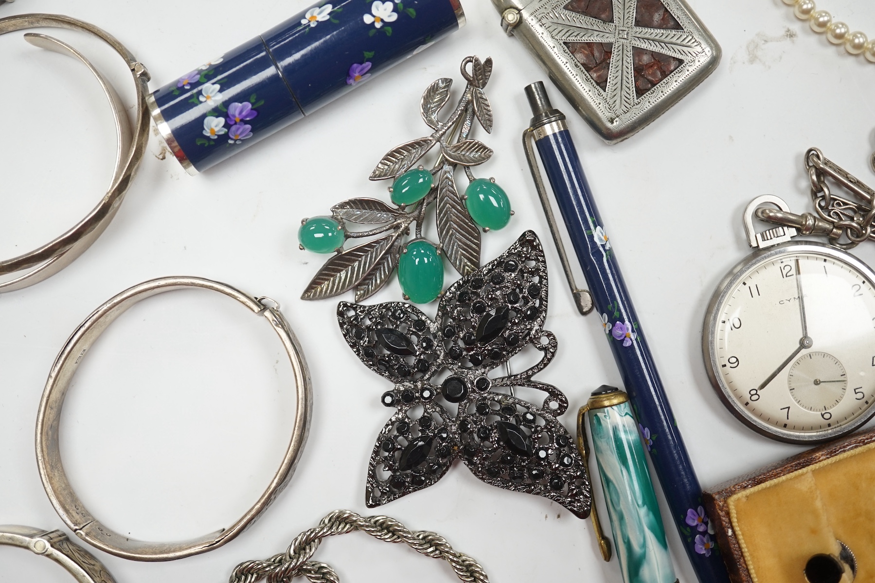 A mixed group of items including silver, white metal and costume jewellery, silver vesta case, silver mounted pepper mill, pens, Victorian mourning brooch, dress pocket watch, etc. Condition - poor to fair